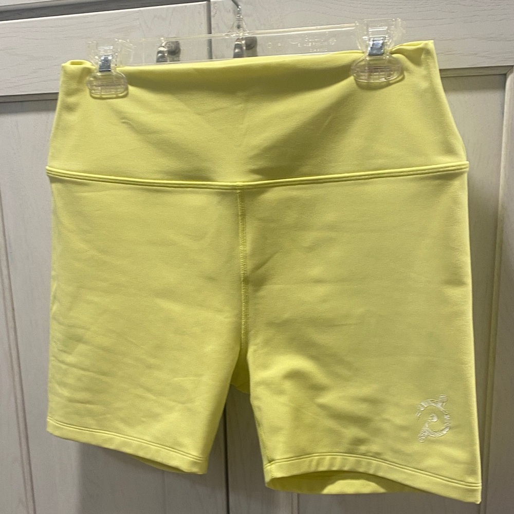 NWOT Peloton vibrant Yellow Fitness shorts.